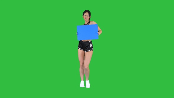 Charming Girl Holding Empty Board and Dancing on A Green