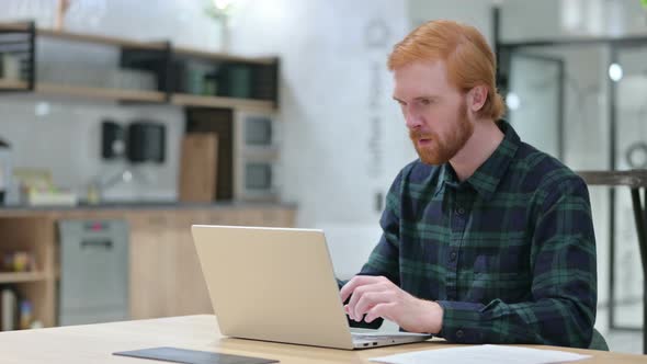 Beard Redhead Man Celebrating Success on Laptop, Winning 