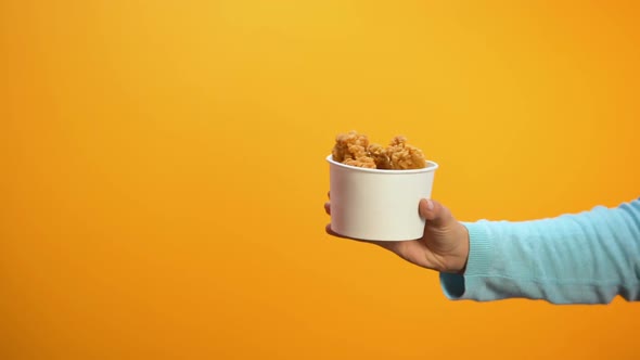 Lady Showing Stop Gesture Refusing to Eat Salty Fried Chicken, Obesity Risk