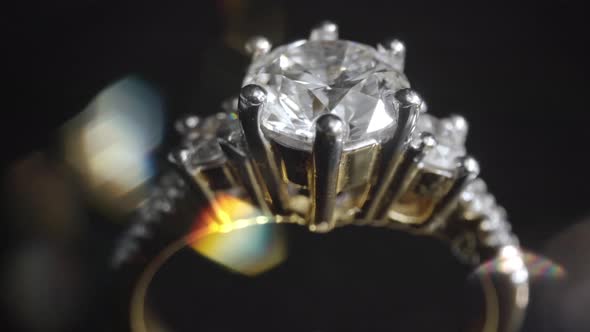 Extreme Detailed of Diamond Ring Close Up Shot While Rotating on Dark Background