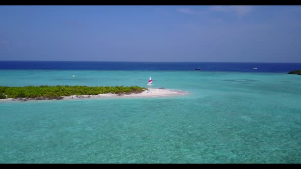 Aerial travel of relaxing coastline beach trip by blue ocean with bright sandy background of a dayou