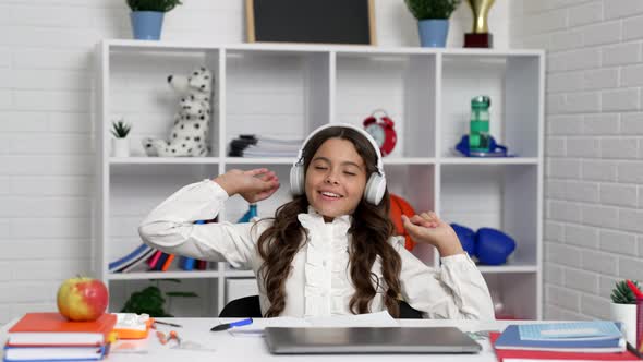 Happy Kid in Earphones Relax After at School Online Lesson with Pc Childhood