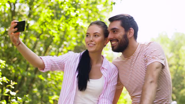 Couple with Bicycles Taking Selfie By Smartphone