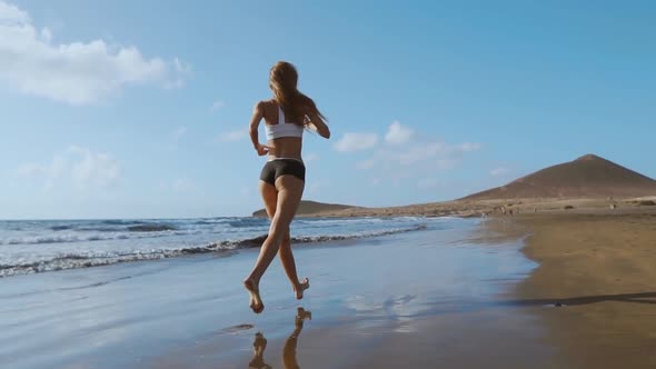 Beautiful Sportive Woman Running Along Beautiful Sandy Beach, Healthy Lifestyle, Enjoying Active