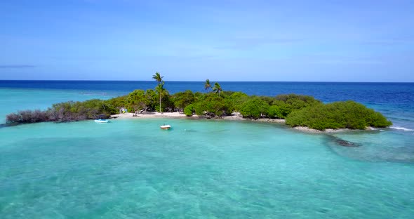 Wide birds eye abstract shot of a white paradise beach and blue sea background in high resolution 4K