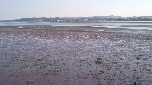 Slow tilt up of The Ridge and River Exe, Lympstone. Aerial footage.