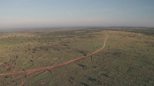 4 wheel drive vehicle on wildlife safari in Kenya. High aerial drone view