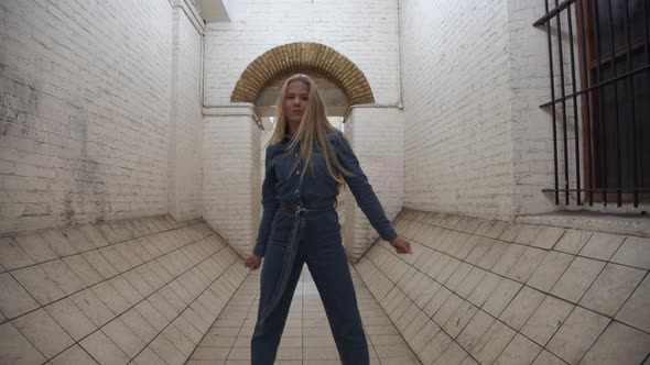 Blond Girl In Jumpsuit Dancing In Tunnel