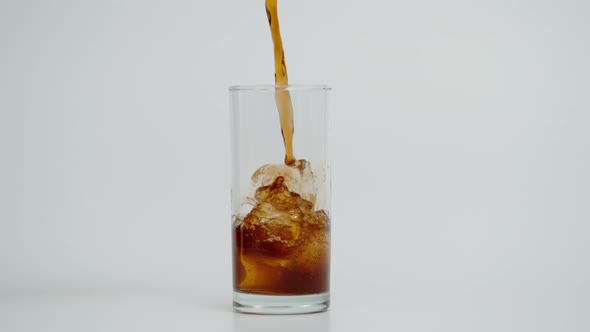 Super Slow Motion of Pouring Cola in Glass with Ice Shot at 1000 Fps