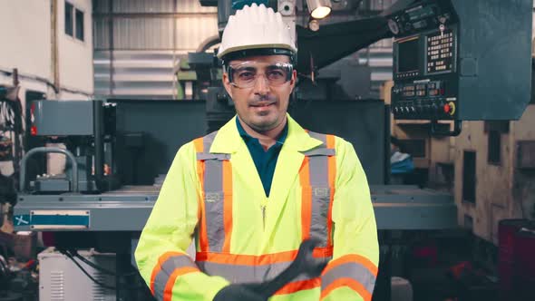 Young Factory Worker or Engineer Close Up Portrait in Factory