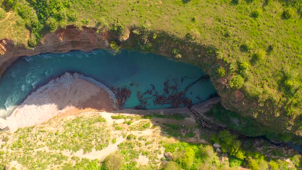 Aerial Top View on Lot of Driftwood in Bluer River on Aksu Canyon in AksuZhabagly Nature Reserve