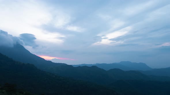 Fluffy fog cloud flowing on natural forest mountain from time lapse sunrise cloudy sky on morning