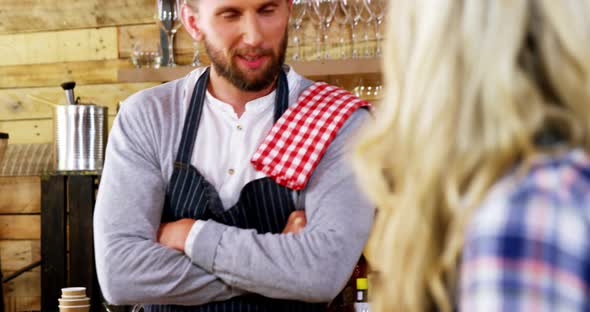 Waiter and waitress interacting with each other