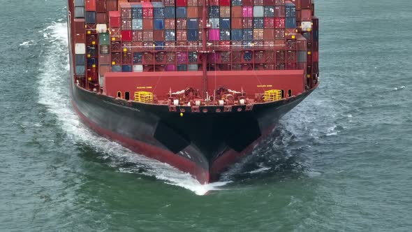 Fully Loaded Container Ship at Sea Transporting Cargo Around the World