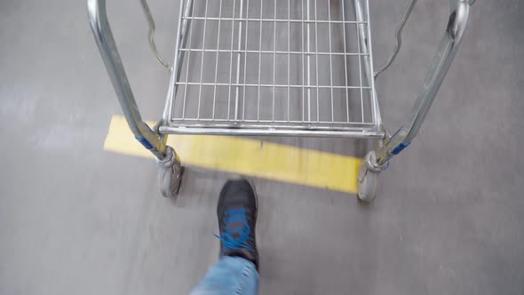 Pulling a Shopping Cart in a Grocery Store