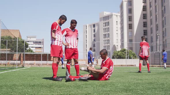 Soccer player with prosthetic leg with soccer team