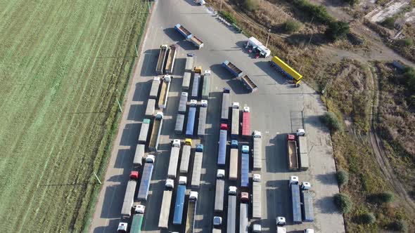 View From Above on a Large Queue of Trucks Waiting at the Port Terminal