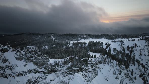 Drone video of snowy mountain, hut on the horizon, pine forest, Oregon, USA