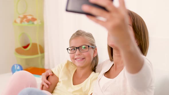 Happy Family Taking Selfie By Smartphone at Home 41