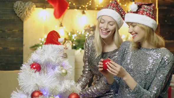 Happy Loving Female Couple Enjoying Christmas. Lesbian Couple Celebrating Christmas. Two Sexy