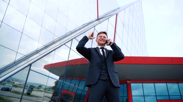 Handsome Businessman Full of Happiness Enjoying Great News About His Business Deal Outdoor