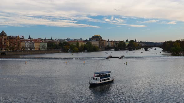 Small tourist boat swim in the Vltava River in Prague Czech Republic.