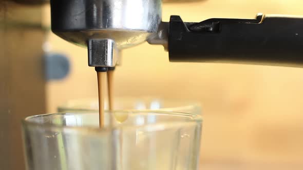 Flowing Coffee From Espresso Maker Machine for Two Persons