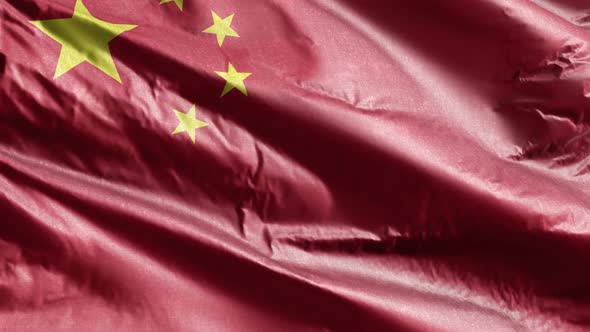 China textile flag waving on the wind. Slow motion. 20 seconds loop.