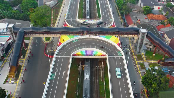 Aerial view of infinity sign traffic junction cross road with car transport.