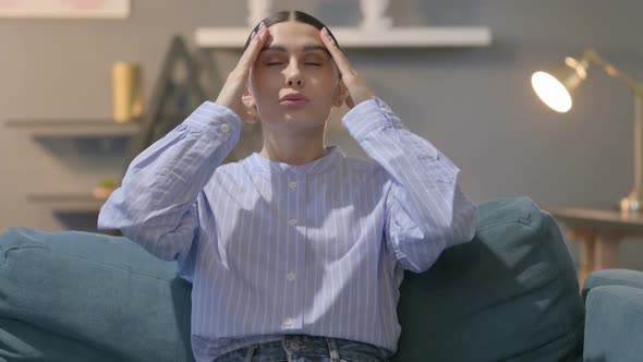 Portrait of Hispanic Woman having Headache