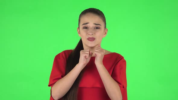 Portrait of Pretty Young Woman Is Looking at Camera with Anticipation, Then Very Upset