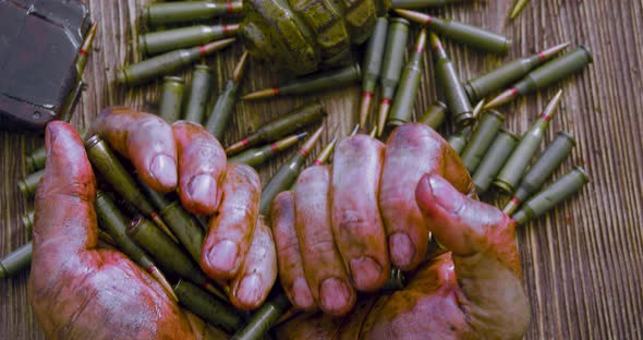 War and Death  Bloodied Hands of a Soldier or Rebel with Bullets