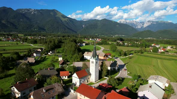 This is a random and beautiful village filmed in the countryside of Slovenia. In the background, a s