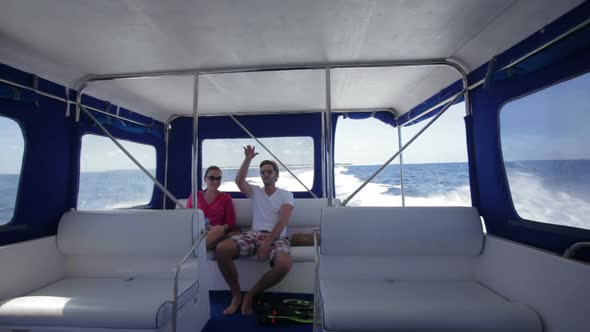 Couple Sitting in Speed Boat