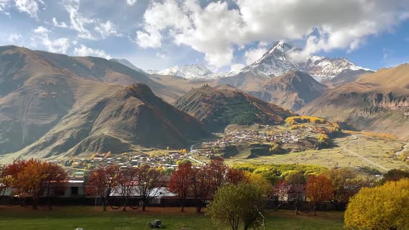 Mountain Kazbek Mkinvartsveri and Town Stepantsminda Autumn Colors of Georgia