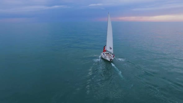 Sailing Boat Swimming Across Ocean with Couple Standing at Bow, Opportunities