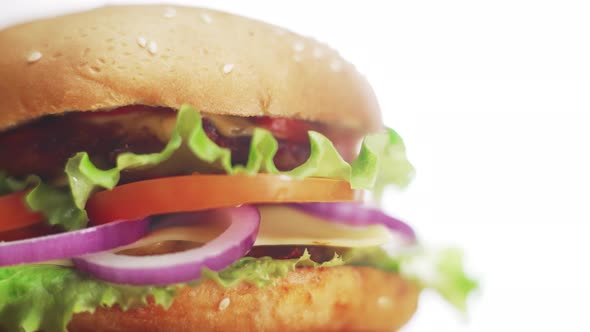 Big and Tasty Burger is Rotating on the Plate