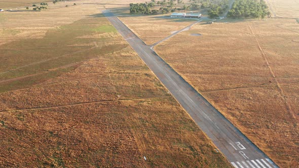 Empty runway of a small airport used for takeoff and landing of light aircraft. Airfield for planes.