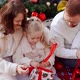 Parents with Children Open Christmas Gifts - VideoHive Item for Sale