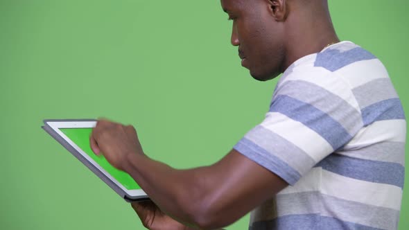 Young African Man Using Digital Tablet