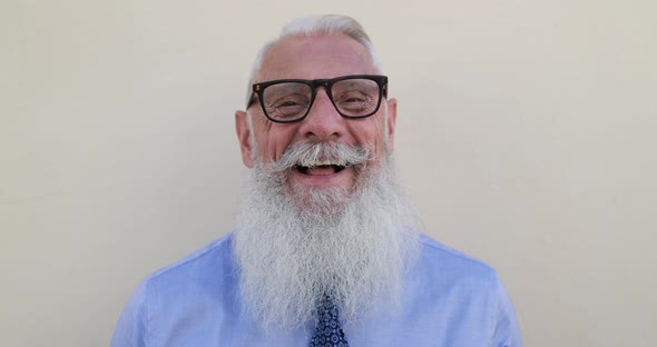 Hipster senior business man smiling in camera
