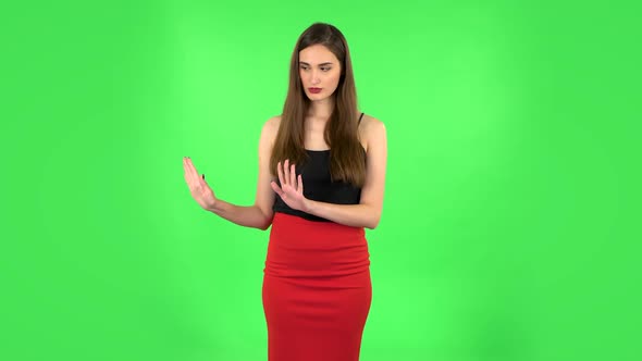 Woman Strictly Gesturing with Hands Shape Meaning Denial Saying NO. Green Screen
