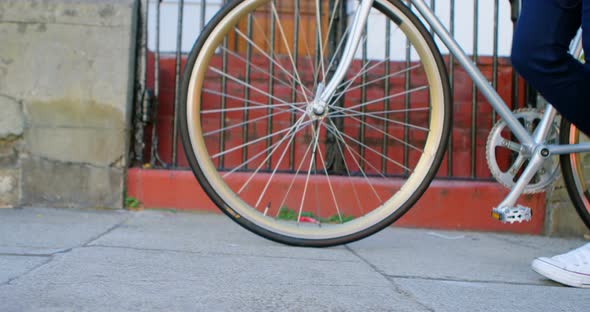 Woman Walking with Bicycle in City Street 4k