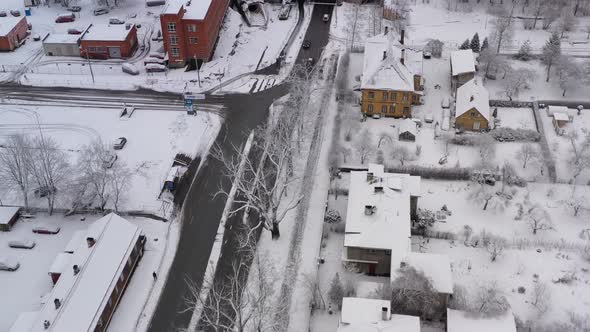 Drone shot of Riia street on during consturction of new bridge in winter under the railroad