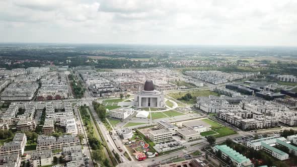 Aerial: Flight over a Cathedral.City View. Narrow small streets and modern buildings. Road traffic