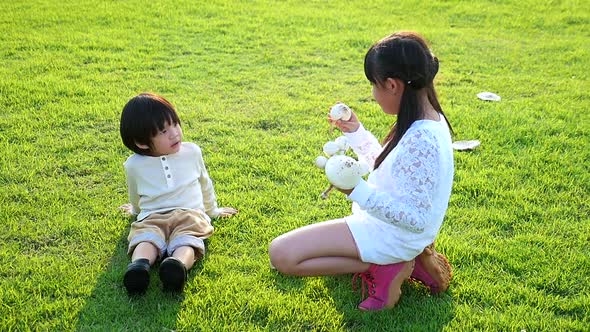 Cute Asian Children Holding Mushroom In The Park