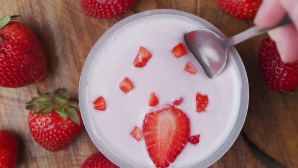 Close-up of Healthy Strawberry and White Yogurt on the Spoon, Concept of Healthy Food Nutrition