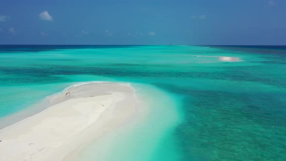 Wide angle above tourism shot of a sunshine white sandy paradise beach and blue sea background in co