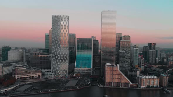 High Slider Drone aerial shot of London Canary Wharf buildings at sunset