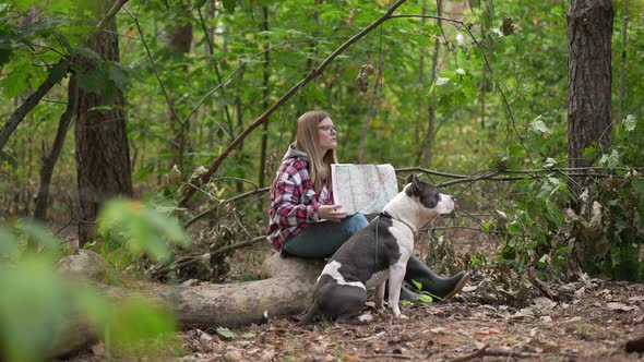 Side View Confident Woman Examining Map in Forest Talking to Dog Pointing Away Leaving in Slow